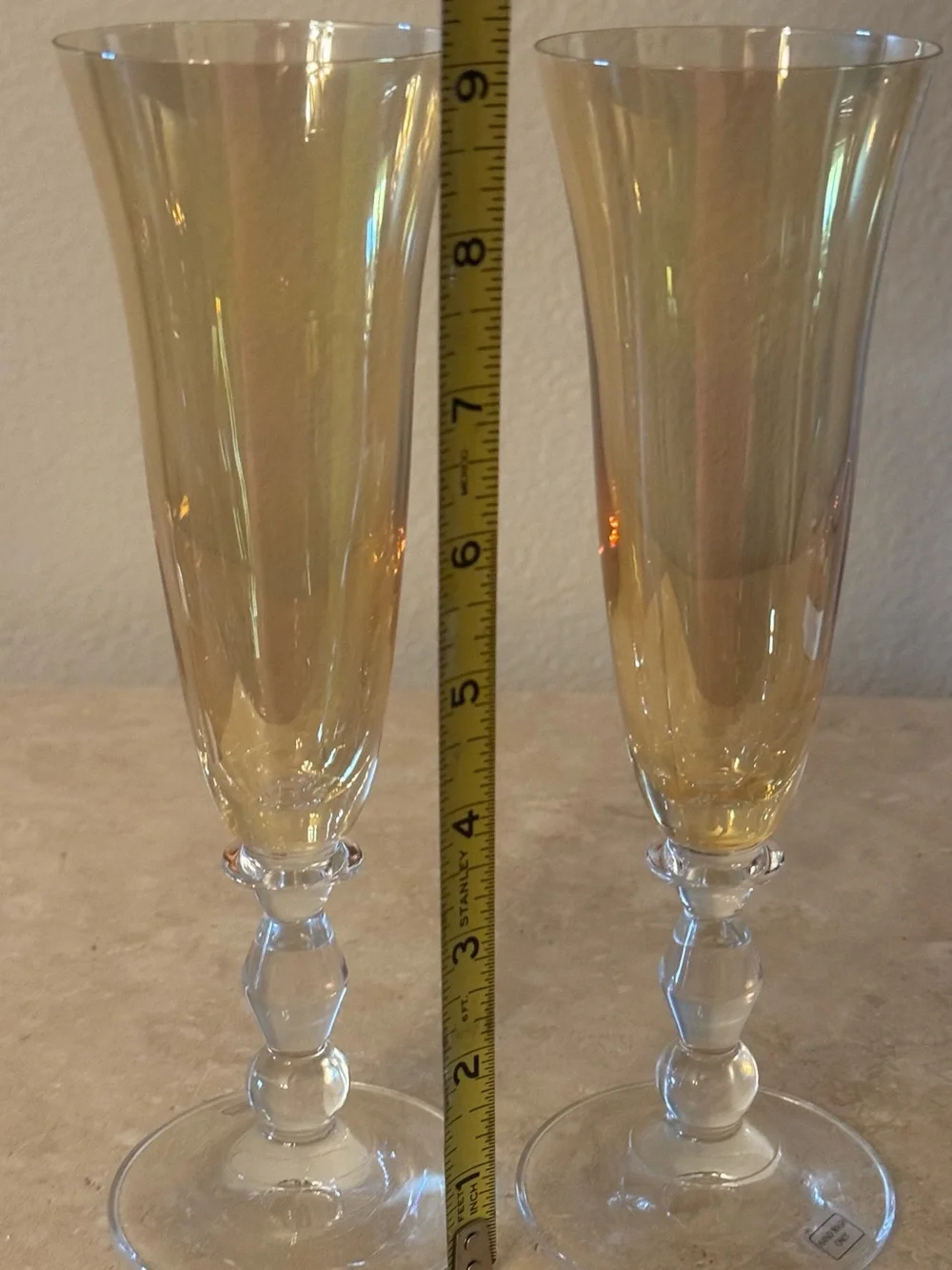 Pair of Vintage Iridescent Amber Fluted Champagne Glasses with Clear Stem.